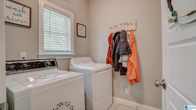 washroom with washing machine and dryer