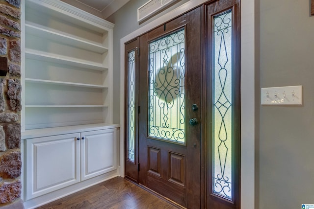 foyer with a healthy amount of sunlight and dark hardwood / wood-style floors