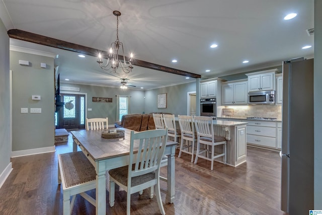 dining area featuring hardwood / wood-style flooring, ceiling fan, and beam ceiling