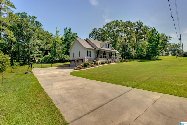 view of front of property featuring a garage and a front yard