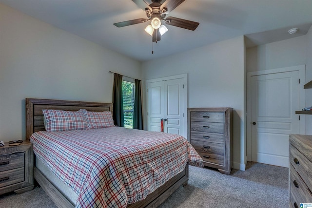 bedroom with ceiling fan and light colored carpet