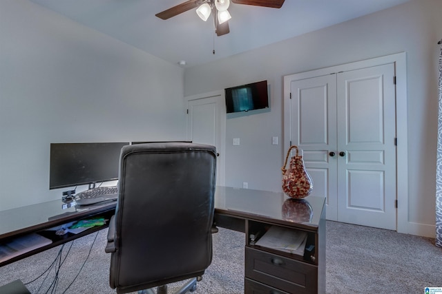 carpeted home office with ceiling fan