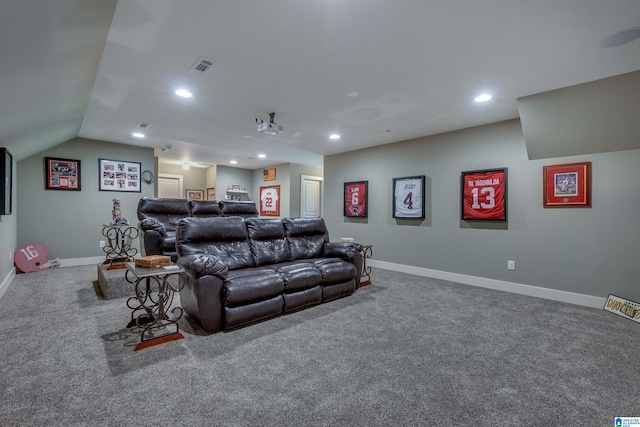 cinema featuring lofted ceiling and carpet flooring