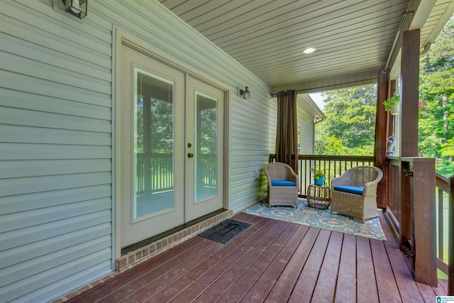 wooden deck featuring french doors