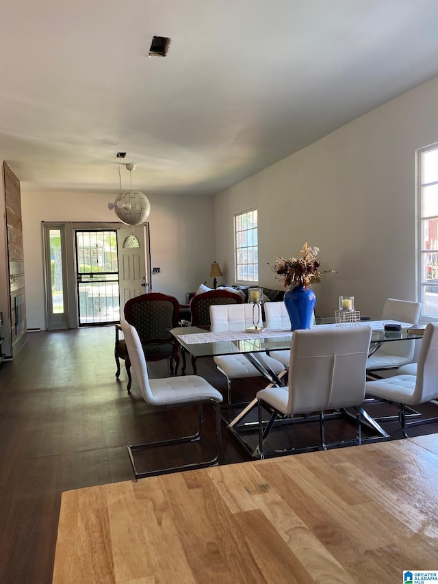 living room with a large fireplace and hardwood / wood-style floors