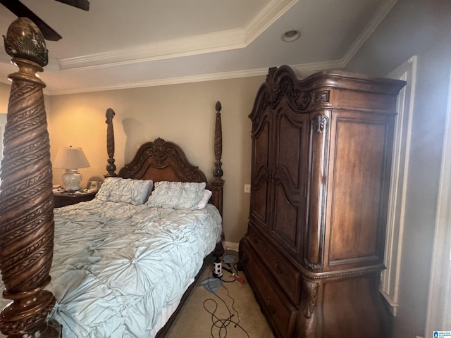 carpeted bedroom with ceiling fan and ornamental molding