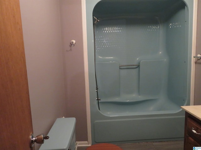 full bathroom featuring shower / washtub combination, vanity, and toilet