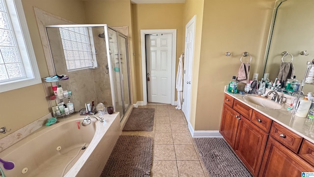 bathroom with independent shower and bath, tile patterned flooring, and vanity