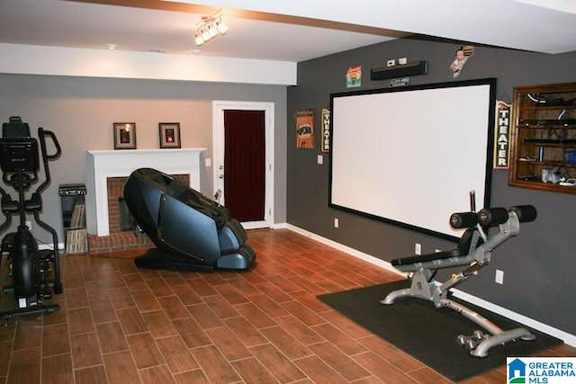 workout room with a fireplace