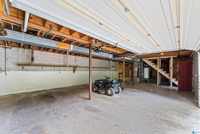 garage featuring a garage door opener and gas water heater