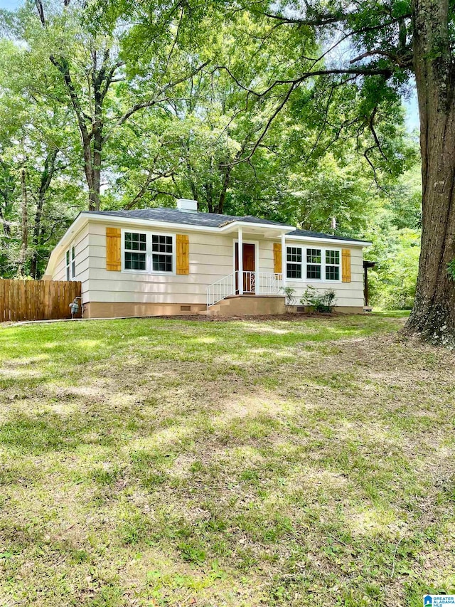 ranch-style home featuring a front yard