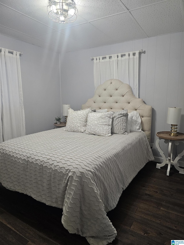 bedroom with wood-type flooring