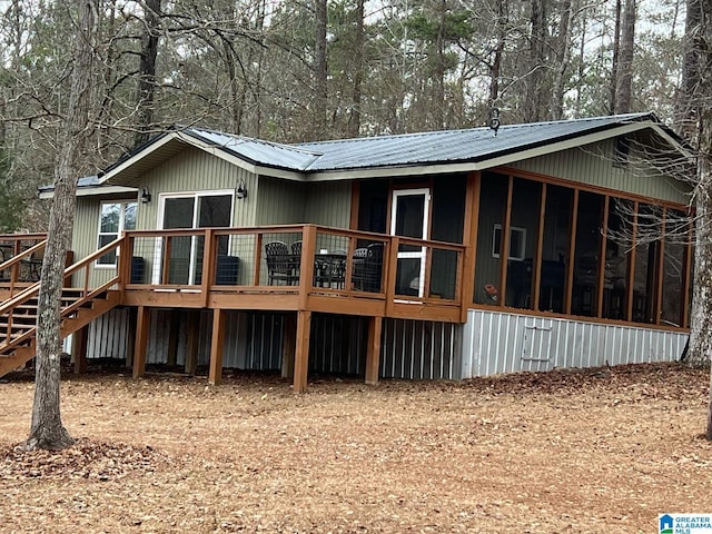 back of property featuring a deck