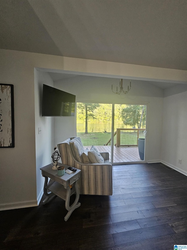 living room with a wealth of natural light and dark hardwood / wood-style floors