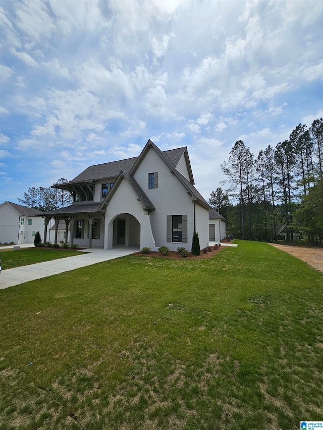 view of front of property featuring a garage and a front lawn