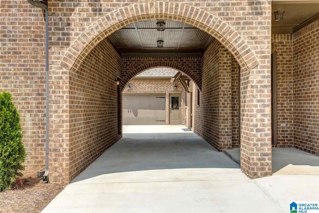 view of exterior entry with a carport