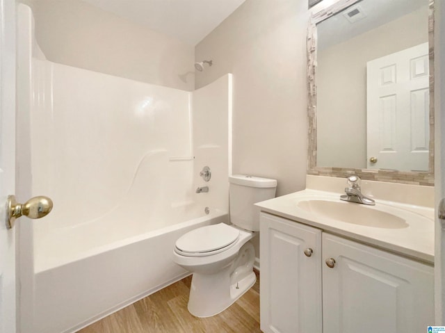 full bathroom featuring shower / bathtub combination, toilet, vanity, and wood-type flooring