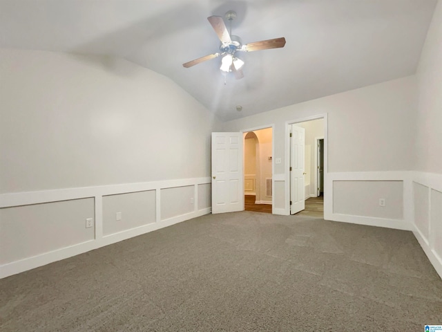 unfurnished bedroom with lofted ceiling, carpet, and ceiling fan