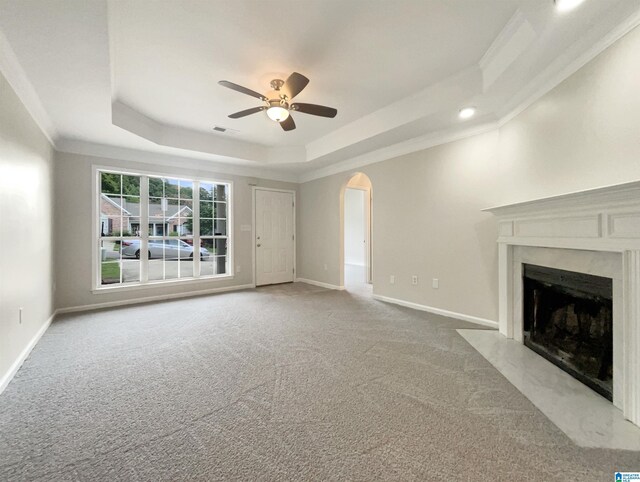 carpeted empty room featuring vaulted ceiling and ceiling fan