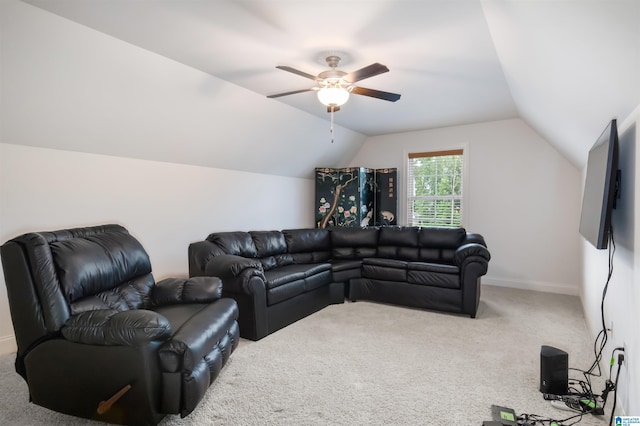 living room featuring lofted ceiling, ceiling fan, and carpet flooring