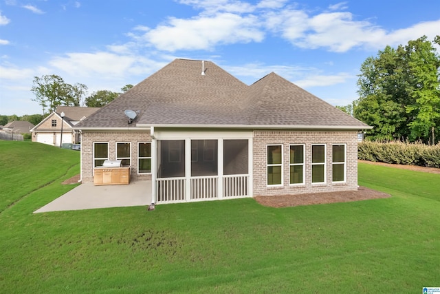 back of property featuring a patio, a sunroom, area for grilling, and a lawn