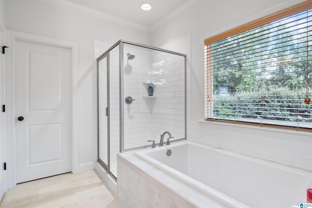 bathroom with crown molding and plus walk in shower