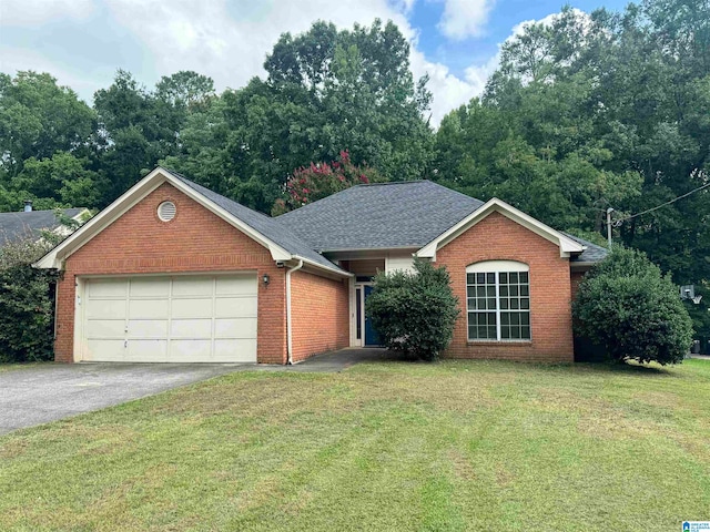 single story home featuring a garage and a front yard