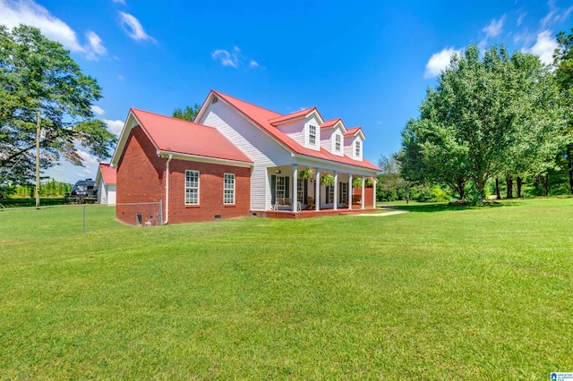 rear view of house featuring a lawn