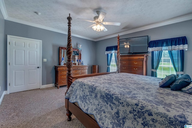 bedroom featuring crown molding, a textured ceiling, ceiling fan, and carpet