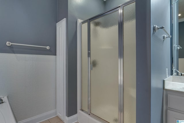 bathroom with vanity, tile patterned flooring, and a shower with shower door