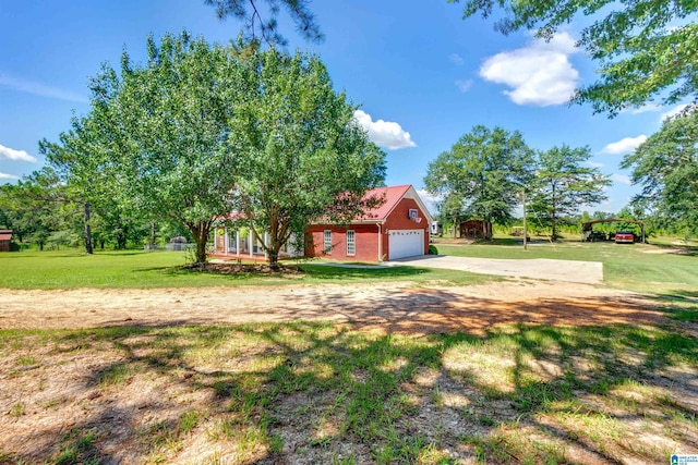 view of yard featuring a garage and a carport