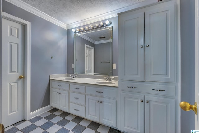 bathroom featuring vanity, crown molding, and a textured ceiling