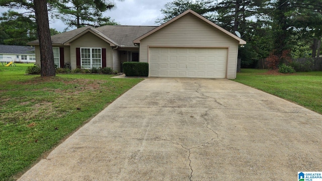 ranch-style house with a garage and a front lawn