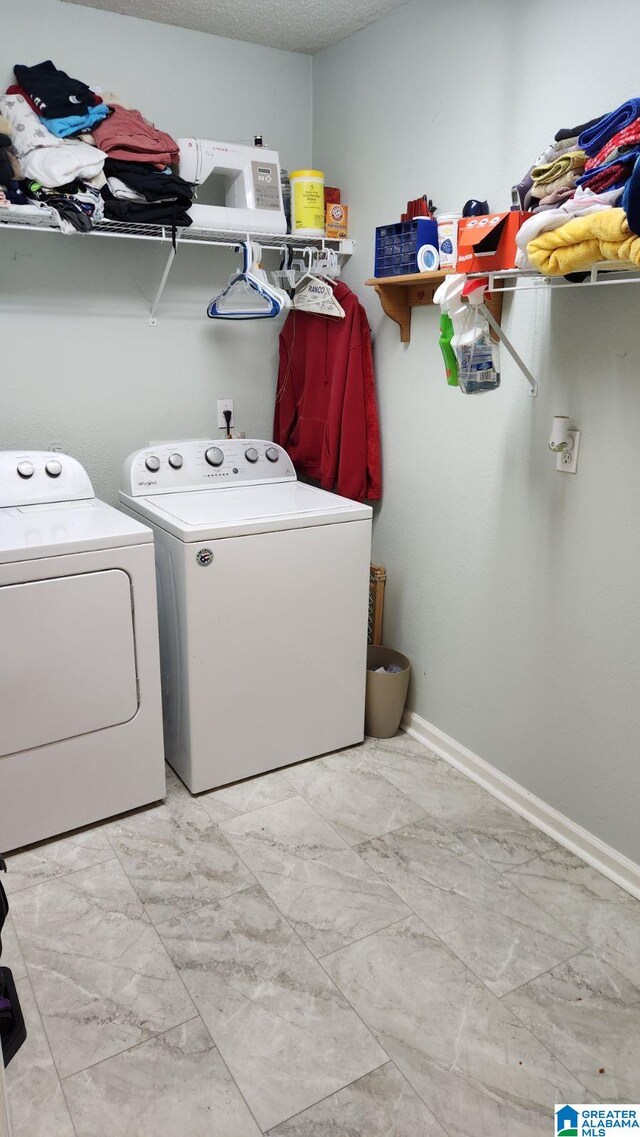 laundry room with washer and dryer