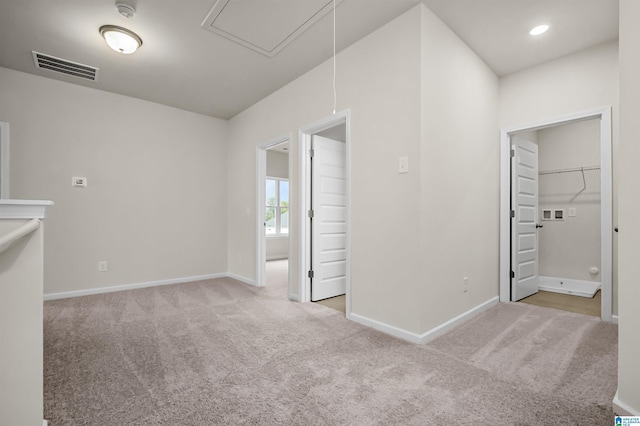 empty room with light colored carpet