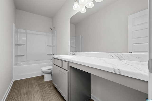 full bathroom with toilet, vanity, and bathtub / shower combination