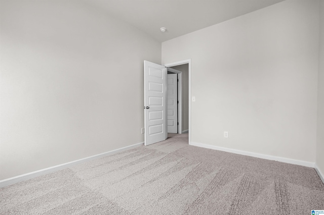 empty room featuring light colored carpet