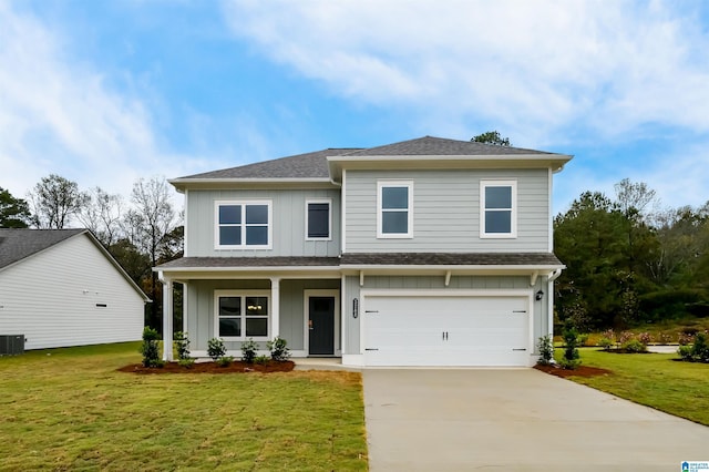 view of front of house with a garage, covered porch, a front lawn, and central air condition unit