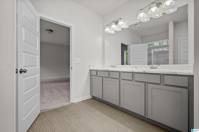 bathroom featuring vanity and hardwood / wood-style floors