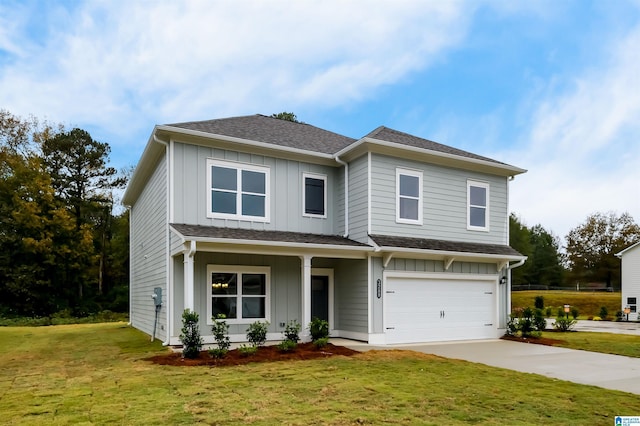 view of front of home with a garage and a front lawn