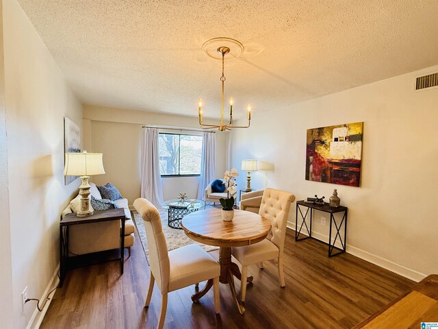 spare room with wood-type flooring and a textured ceiling