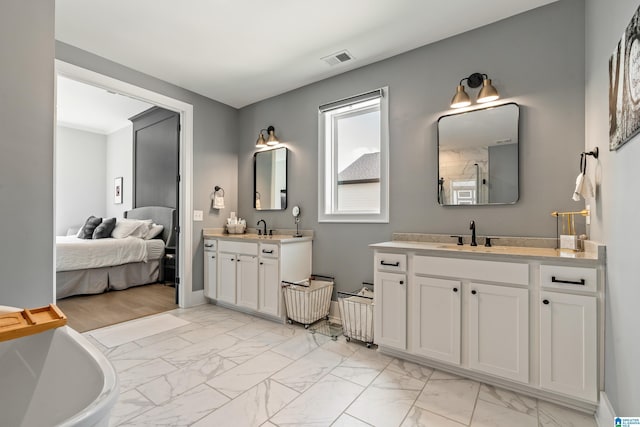 bathroom featuring a bathing tub and vanity