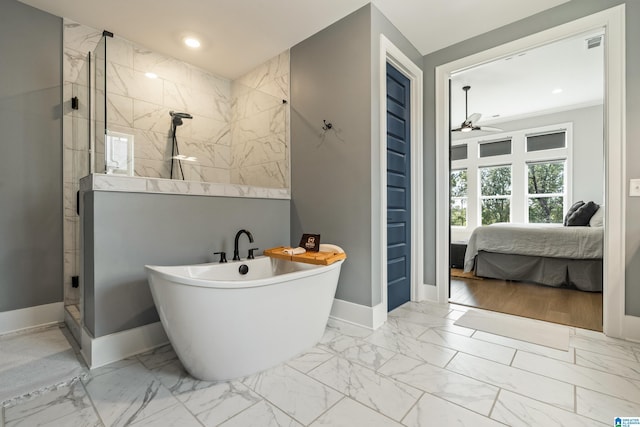 bathroom with ceiling fan and separate shower and tub