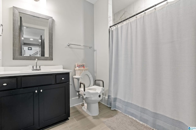 bathroom with vanity, toilet, and a shower with shower curtain