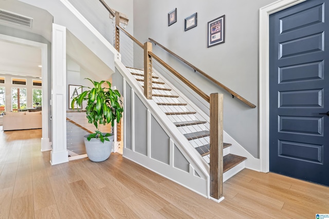 stairway featuring wood-type flooring