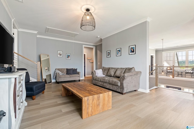 living room with crown molding and light hardwood / wood-style flooring