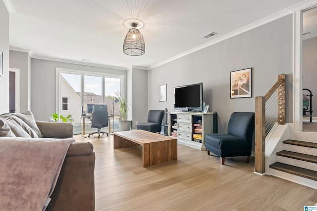 living room featuring light hardwood / wood-style flooring and ornamental molding