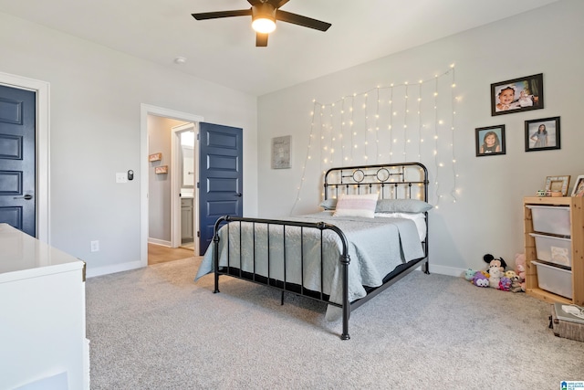 bedroom with ceiling fan and light carpet