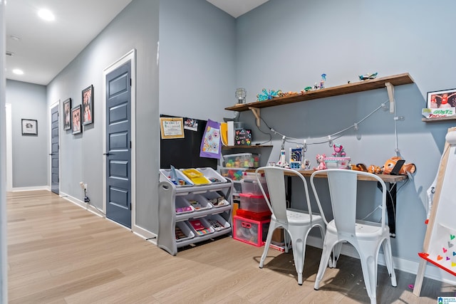 recreation room featuring light hardwood / wood-style flooring