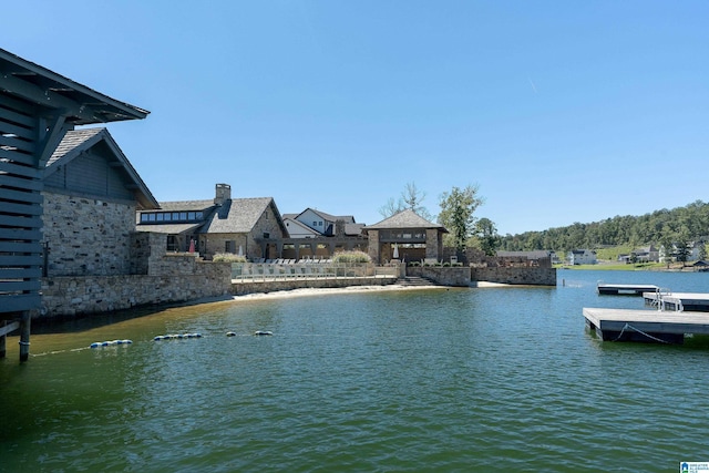 property view of water featuring a gazebo and a boat dock